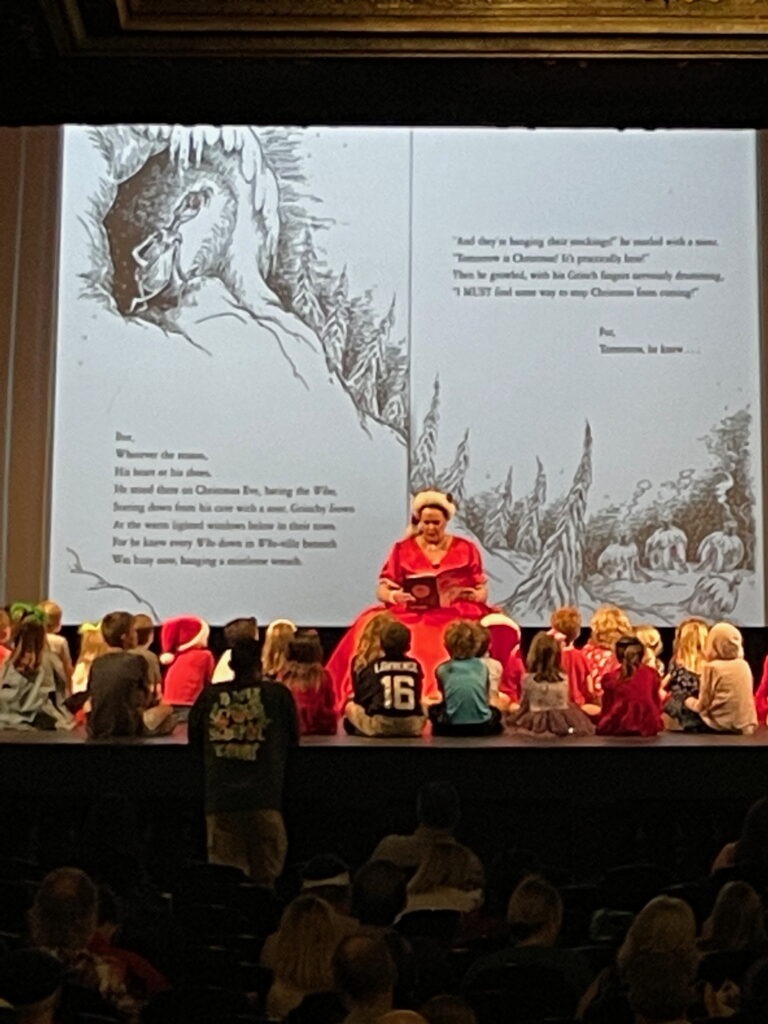 Samantha performing How the Grinch Stole Christmas as Mrs. Claus at The Tampa Theatre